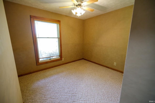 unfurnished room with carpet floors and ceiling fan