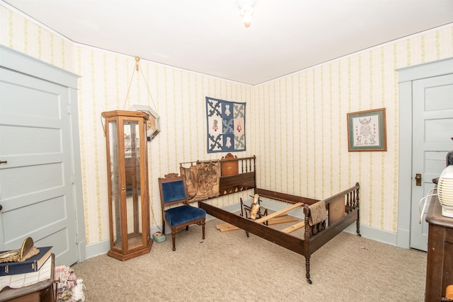 bedroom with baseboards, carpet floors, and wallpapered walls