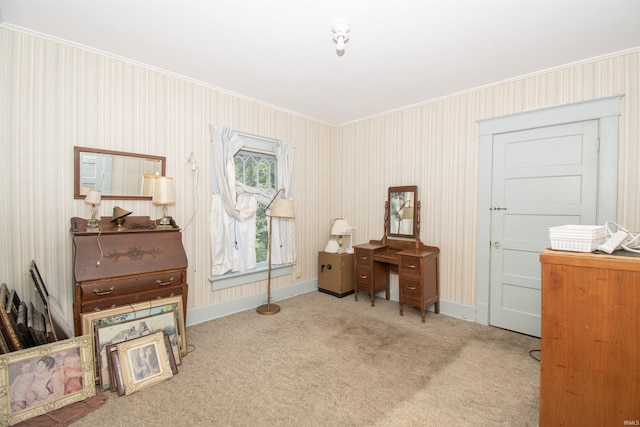 interior space featuring light carpet, crown molding, and baseboards