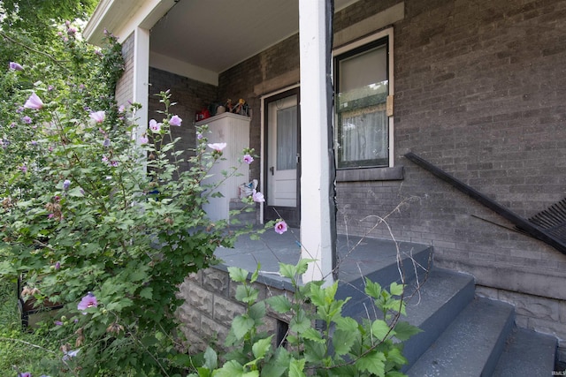 property entrance with brick siding