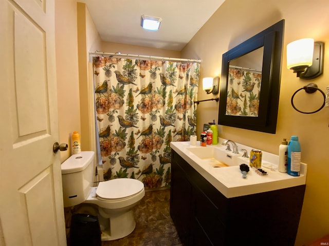 bathroom featuring tile patterned flooring, toilet, vanity, and curtained shower