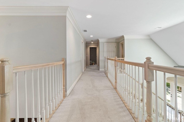 hall featuring carpet floors, vaulted ceiling, and ornamental molding