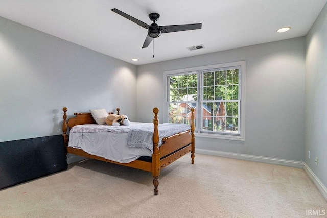 carpeted bedroom featuring ceiling fan