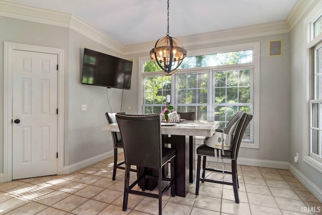 tiled dining space with crown molding and an inviting chandelier