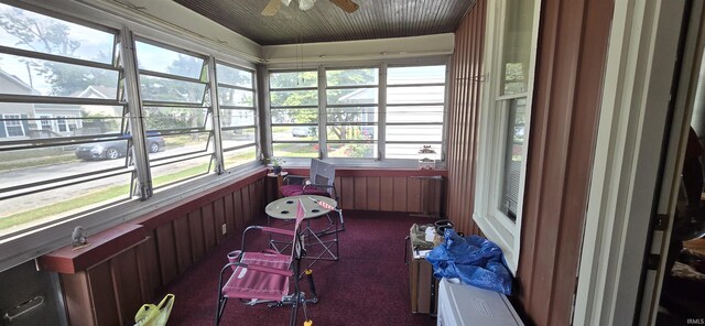 sunroom / solarium featuring ceiling fan