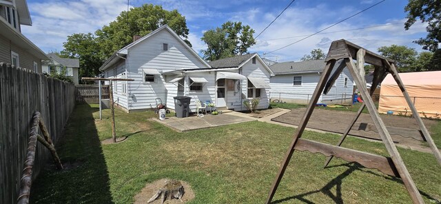 back of house with a yard