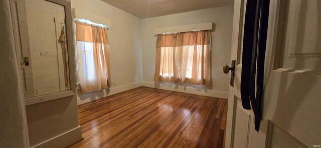 spare room featuring hardwood / wood-style flooring