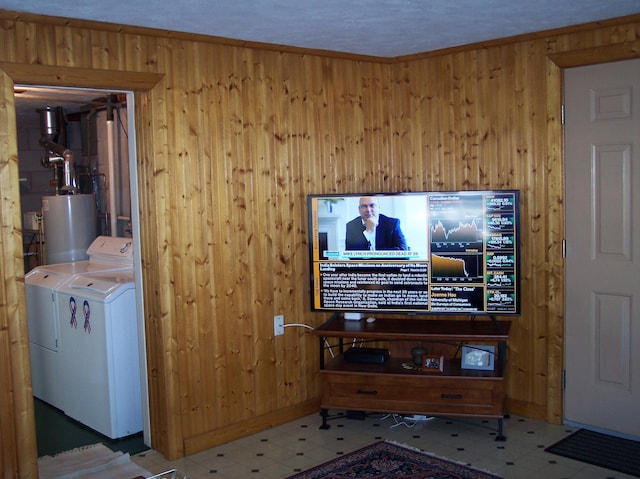 living area featuring wooden walls, gas water heater, and tile patterned floors