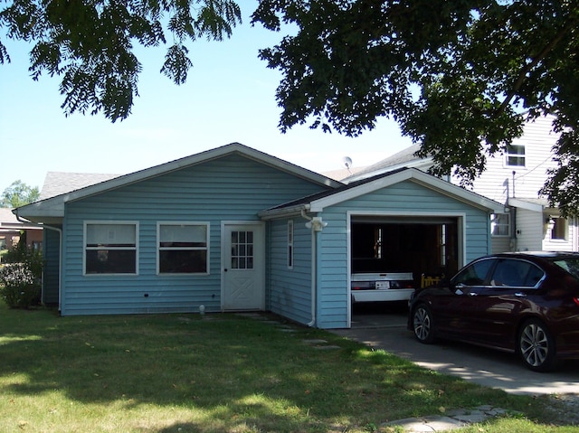 view of front facade with a garage and a front lawn