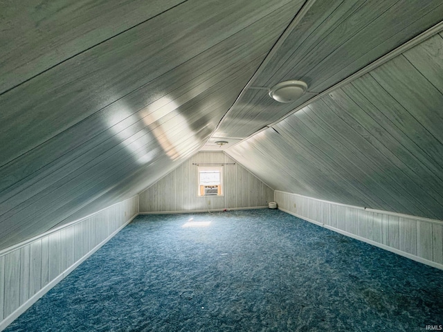 bonus room featuring lofted ceiling and carpet floors