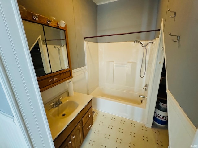 bathroom with washtub / shower combination, tile patterned floors, and vanity