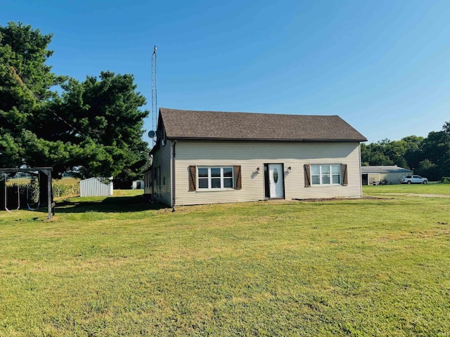 bungalow-style home with a front lawn