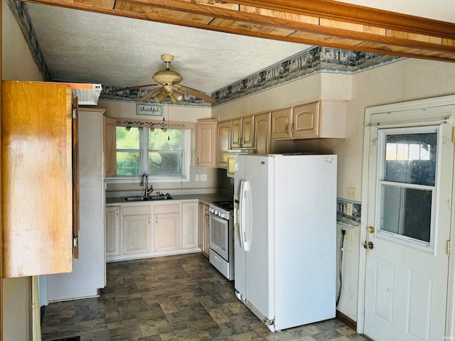 kitchen with sink, white refrigerator with ice dispenser, gas stove, light brown cabinets, and ceiling fan