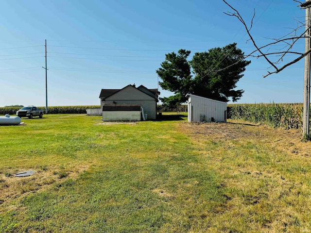 view of yard with an outdoor structure and a garage