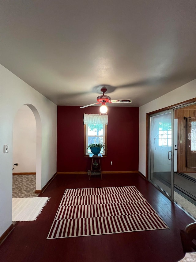 interior space with ceiling fan and wood-type flooring