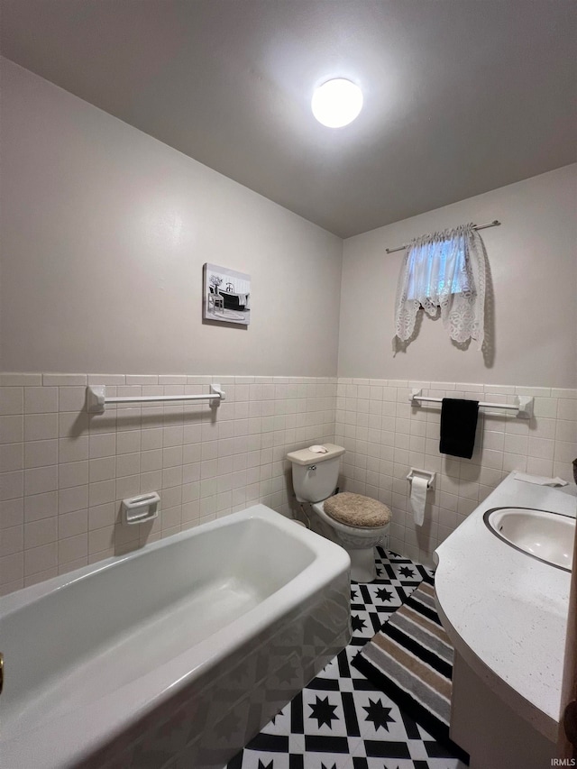 bathroom featuring a bath, tile patterned flooring, tile walls, and toilet