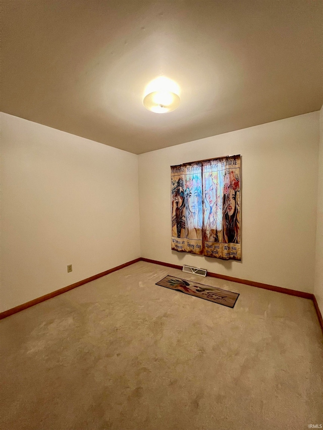 spare room featuring carpet flooring