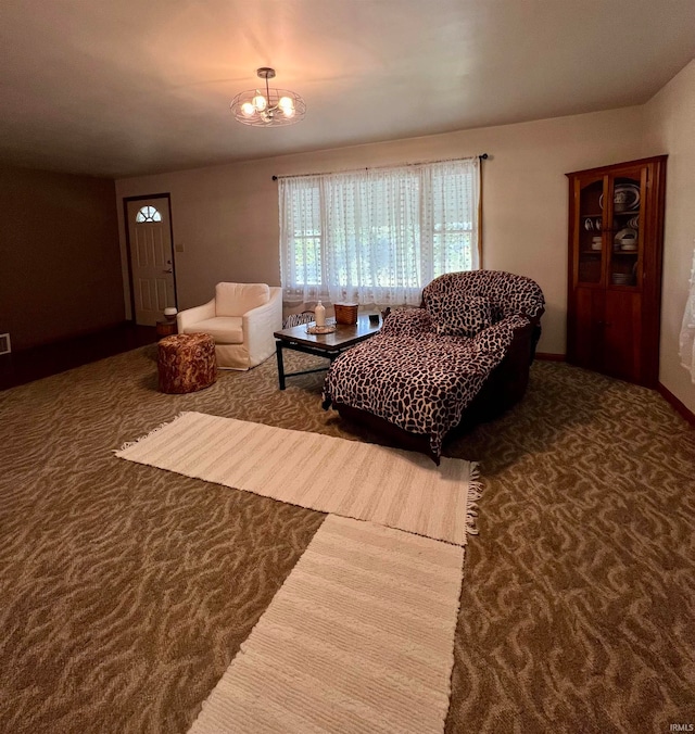 living room featuring carpet floors and a chandelier