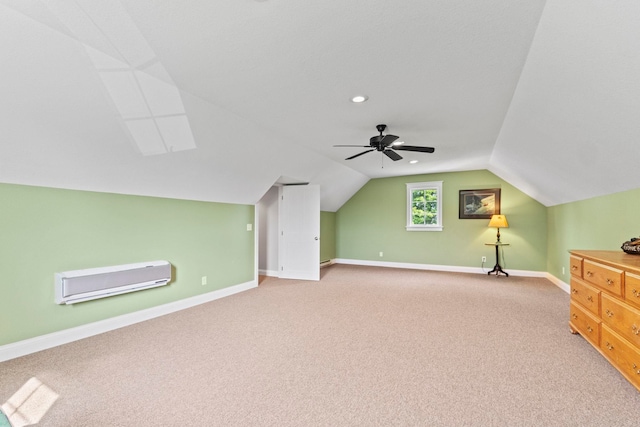 bonus room featuring light colored carpet, recessed lighting, vaulted ceiling, a wall unit AC, and baseboards