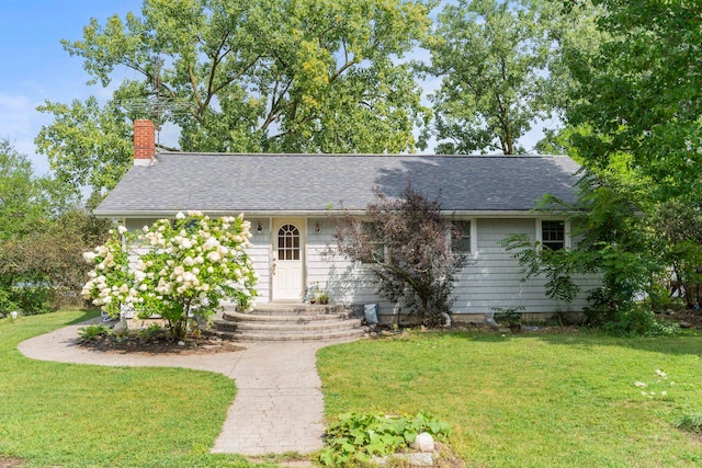 11585 E 565 N, Orland, IN 46776 - ranch-style home with a shingled roof, a front lawn, and a chimney