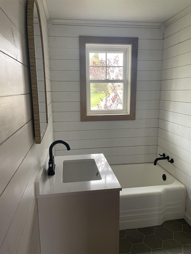 11585 E 565 N, Orland, IN 46776 - bathroom with tile patterned flooring, wood walls, vanity, and a tub
