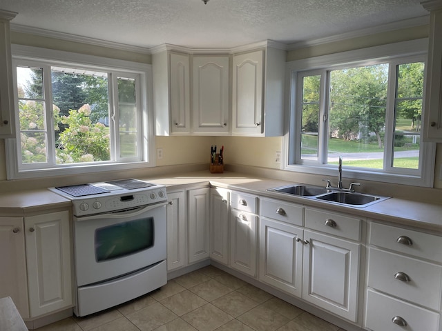11585 E 565 N, Orland, IN 46776 - kitchen with light countertops, light tile patterned floors, a sink, white cabinets, and white electric range