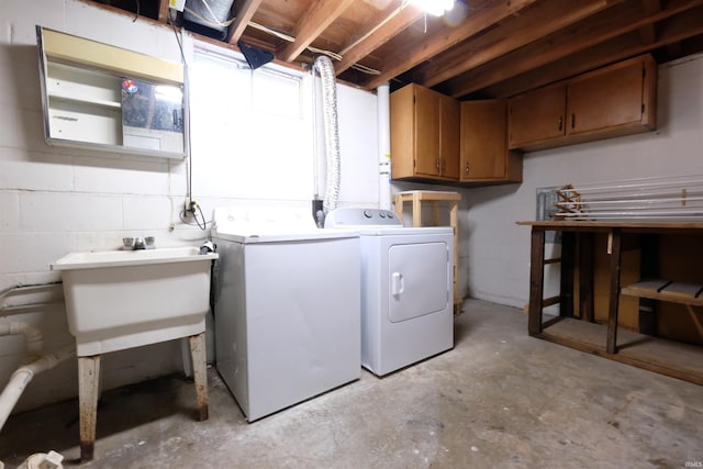 washroom featuring washer and dryer and sink