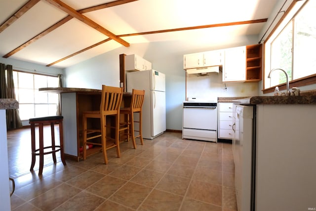 kitchen with tile patterned flooring, custom range hood, stove, and white refrigerator