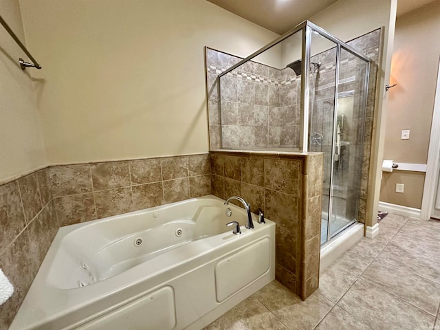 bathroom featuring plus walk in shower and tile patterned flooring