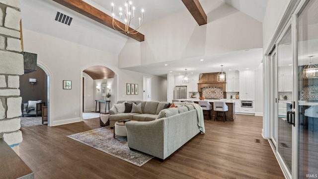 living room featuring a notable chandelier, high vaulted ceiling, dark wood-type flooring, and beamed ceiling