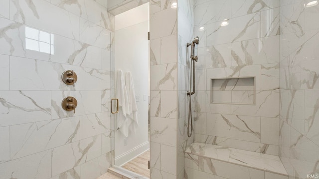 bathroom featuring a shower stall