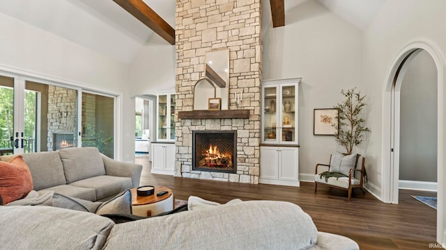 living room featuring beamed ceiling, high vaulted ceiling, dark hardwood / wood-style flooring, and a fireplace