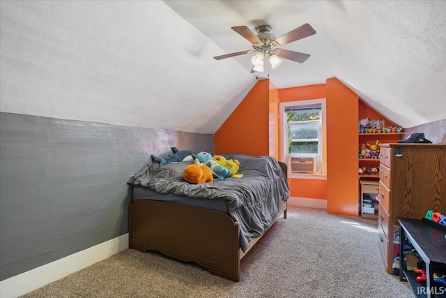 bedroom with vaulted ceiling, a textured ceiling, ceiling fan, and carpet