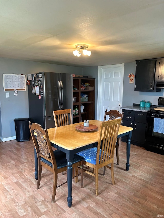 dining space with light wood-type flooring