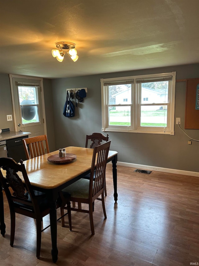 dining room with hardwood / wood-style flooring