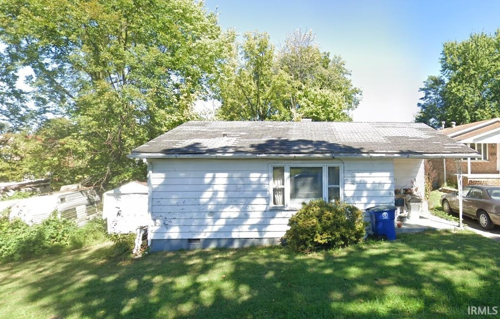 view of property exterior featuring a yard