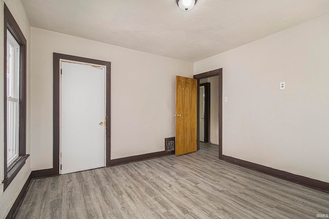 unfurnished room featuring light hardwood / wood-style flooring