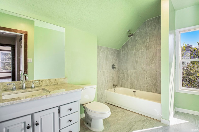 full bathroom with a textured ceiling, vanity, toilet, tiled shower / bath, and lofted ceiling