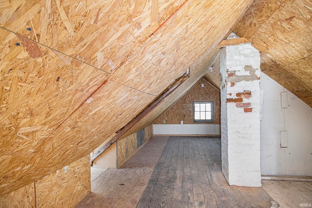 bonus room featuring hardwood / wood-style flooring and vaulted ceiling