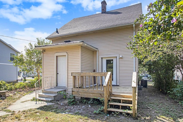 rear view of house with a wooden deck