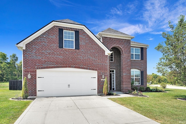 view of front property with a garage and a front lawn