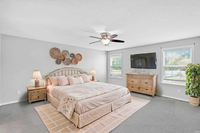 bedroom with visible vents, a ceiling fan, baseboards, and carpet floors