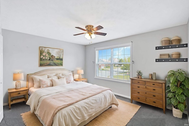 bedroom featuring baseboards, carpet, and a ceiling fan