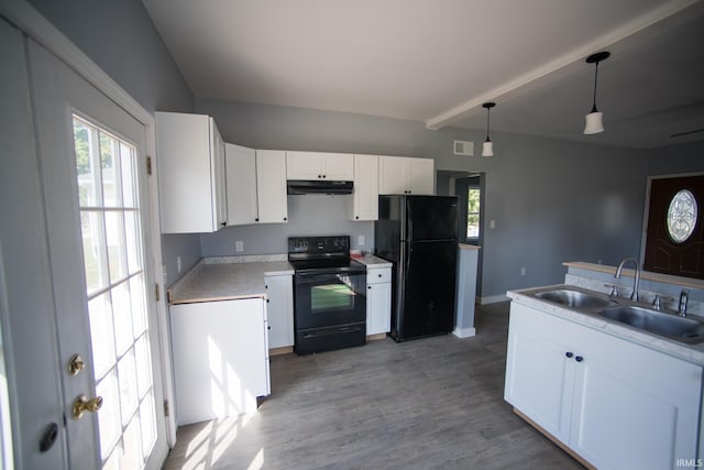 kitchen with a sink, black appliances, white cabinets, under cabinet range hood, and light wood-type flooring