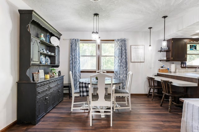 dining area featuring dark hardwood / wood-style floors