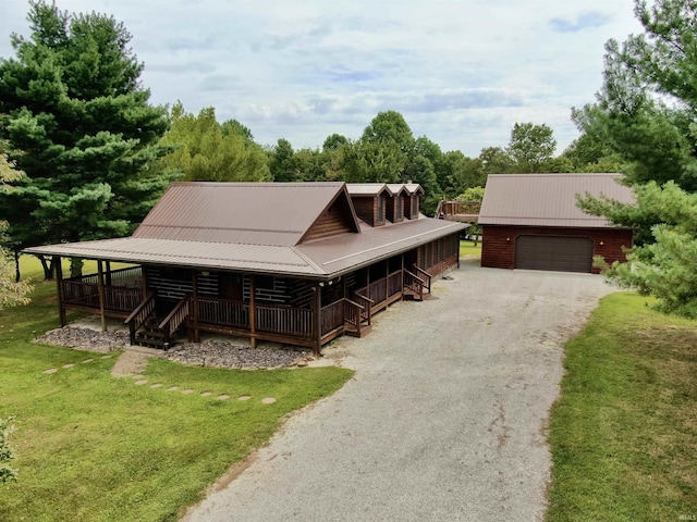 cabin with metal roof and an outdoor structure