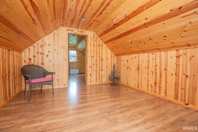 interior space featuring wood ceiling, vaulted ceiling, wooden walls, and wood finished floors