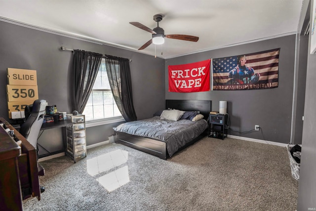 bedroom with ceiling fan, crown molding, and carpet floors