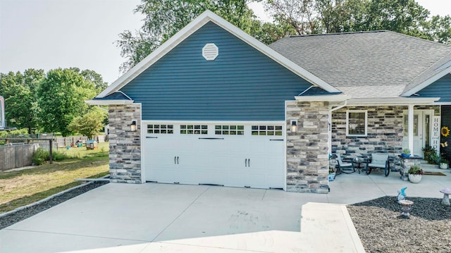 view of front of home with a garage and a front yard