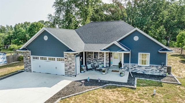 view of front of property featuring a garage and a front lawn